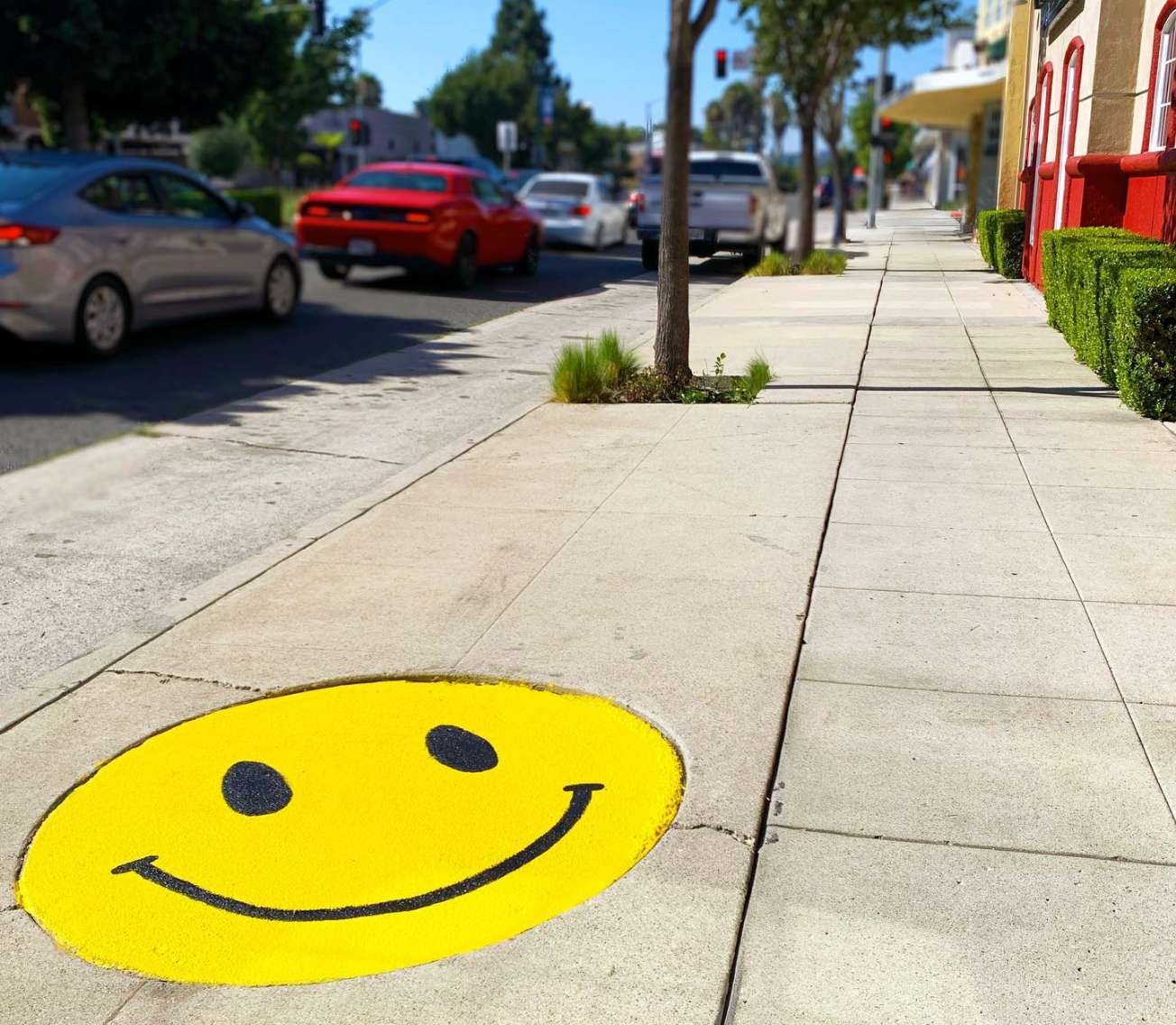 Smiley face decoration on sidewalk